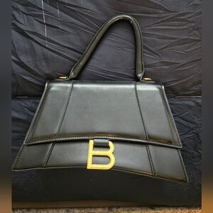 Elegant Black Handbag with Gold Accent